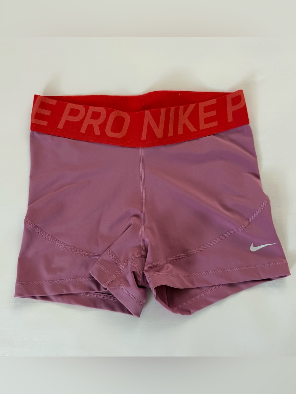 Nike Pro Women's Mauve Pink Training Shorts with Red Elastic Waistband